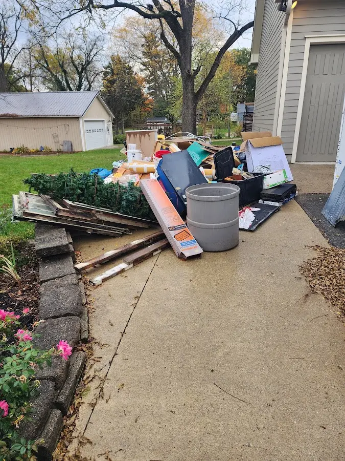 Dumpster being loaded with debris for 3 Yard Dumpster Rental in Arabi